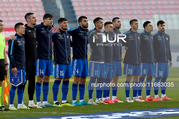 Soccer players from Moldova stand during the playing of their country’s national anthem prior to the UEFA Nations League, League D, Group D2...