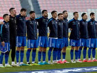 Soccer players from Moldova stand during the playing of their country’s national anthem prior to the UEFA Nations League, League D, Group D2...