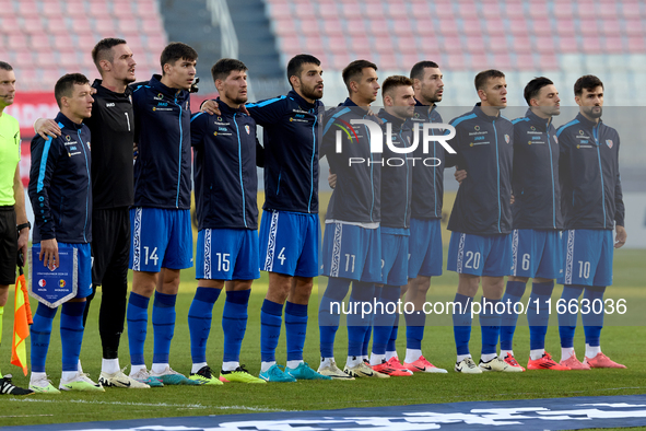 Soccer players from Moldova stand during the playing of their country’s national anthem prior to the UEFA Nations League, League D, Group D2...