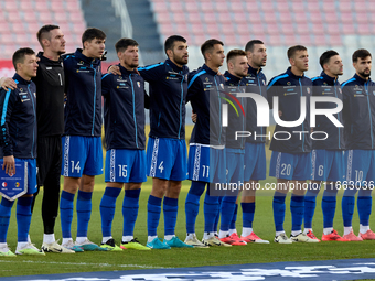 Soccer players from Moldova stand during the playing of their country’s national anthem prior to the UEFA Nations League, League D, Group D2...