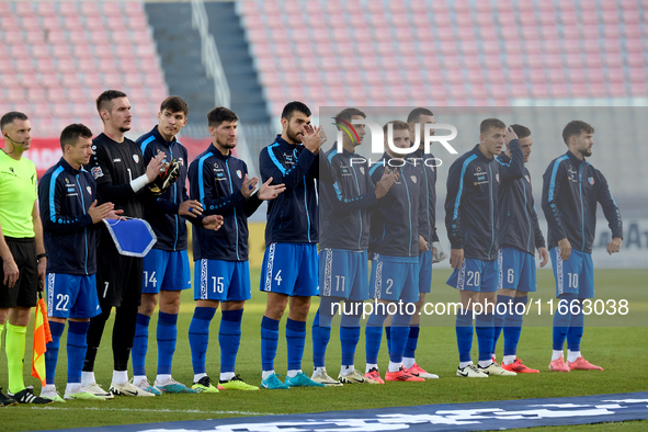 Soccer players from Moldova stand before the playing of their country’s national anthem prior to the UEFA Nations League, League D, Group D2...