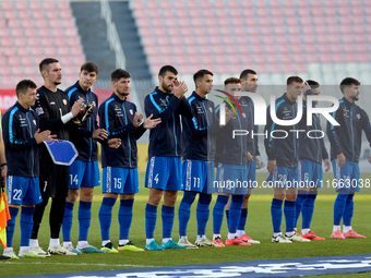 Soccer players from Moldova stand before the playing of their country’s national anthem prior to the UEFA Nations League, League D, Group D2...