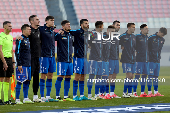 Soccer players from Moldova stand during the playing of their country’s national anthem prior to the UEFA Nations League, League D, Group D2...