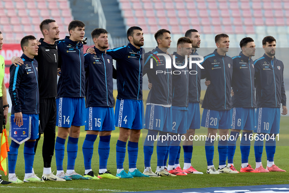 Soccer players from Moldova stand during the playing of their country’s national anthem prior to the UEFA Nations League, League D, Group D2...