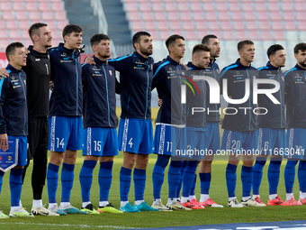 Soccer players from Moldova stand during the playing of their country’s national anthem prior to the UEFA Nations League, League D, Group D2...