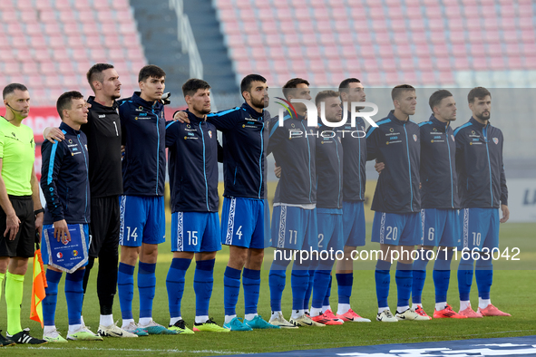 Soccer players from Moldova stand during the playing of their country’s national anthem prior to the UEFA Nations League, League D, Group D2...