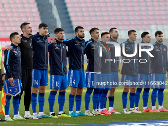 Soccer players from Moldova stand during the playing of their country’s national anthem prior to the UEFA Nations League, League D, Group D2...