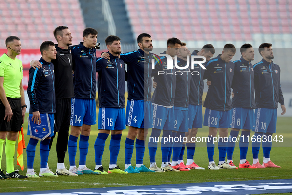 Soccer players from Moldova stand during the playing of their country’s national anthem prior to the UEFA Nations League, League D, Group D2...