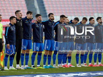 Soccer players from Moldova stand during the playing of their country’s national anthem prior to the UEFA Nations League, League D, Group D2...