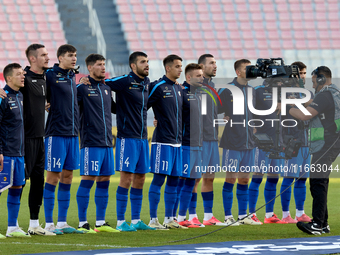 Soccer players from Moldova stand during the playing of their country’s national anthem prior to the UEFA Nations League, League D, Group D2...