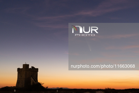 The comet Tsuchinshan-ATLAS (C/2023 A3) is seen over Torre Squillace, near Lecce, Italy, on October 13, 2024. The comet's coma, or head, mea...