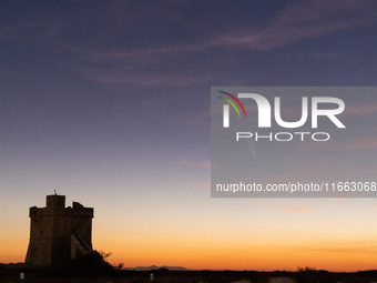 The comet Tsuchinshan-ATLAS (C/2023 A3) is seen over Torre Squillace, near Lecce, Italy, on October 13, 2024. The comet's coma, or head, mea...