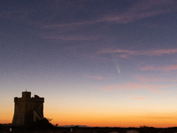 The comet Tsuchinshan-ATLAS (C/2023 A3) is seen over Torre Squillace, near Lecce, Italy, on October 13, 2024. The comet's coma, or head, mea...