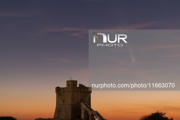 The comet Tsuchinshan-ATLAS (C/2023 A3) is seen over Torre Squillace, near Lecce, Italy, on October 13, 2024. The comet's coma, or head, mea...