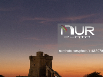 The comet Tsuchinshan-ATLAS (C/2023 A3) is seen over Torre Squillace, near Lecce, Italy, on October 13, 2024. The comet's coma, or head, mea...