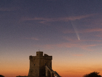 The comet Tsuchinshan-ATLAS (C/2023 A3) is seen over Torre Squillace, near Lecce, Italy, on October 13, 2024. The comet's coma, or head, mea...