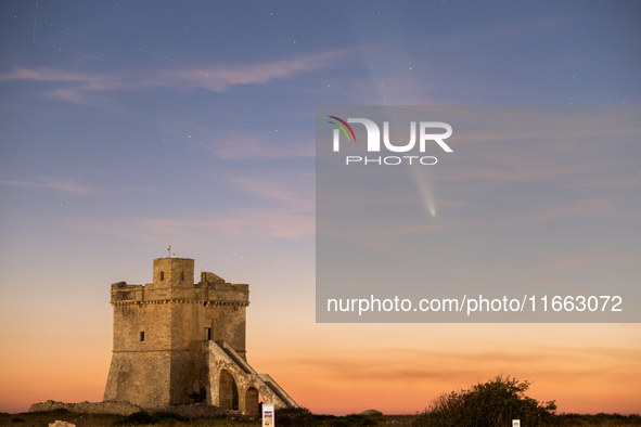 The comet Tsuchinshan-ATLAS (C/2023 A3) is seen over Torre Squillace, near Lecce, Italy, on October 13, 2024. The comet's coma, or head, mea...