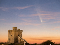 The comet Tsuchinshan-ATLAS (C/2023 A3) is seen over Torre Squillace, near Lecce, Italy, on October 13, 2024. The comet's coma, or head, mea...