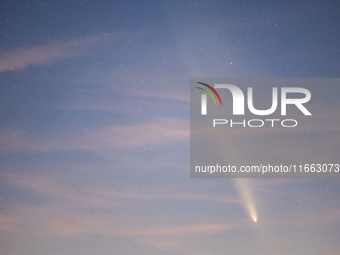 The comet Tsuchinshan-ATLAS (C/2023 A3) is seen over Torre Squillace, near Lecce, Italy, on October 13, 2024. The comet's coma, or head, mea...