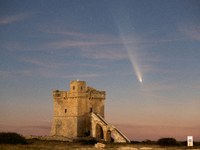 The comet Tsuchinshan-ATLAS (C/2023 A3) is seen over Torre Squillace, near Lecce, Italy, on October 13, 2024. The comet's coma, or head, mea...