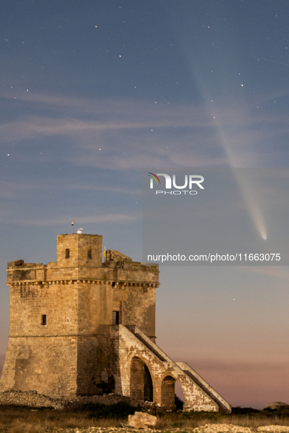 The comet Tsuchinshan-ATLAS (C/2023 A3) is seen over Torre Squillace, near Lecce, Italy, on October 13, 2024. The comet's coma, or head, mea...