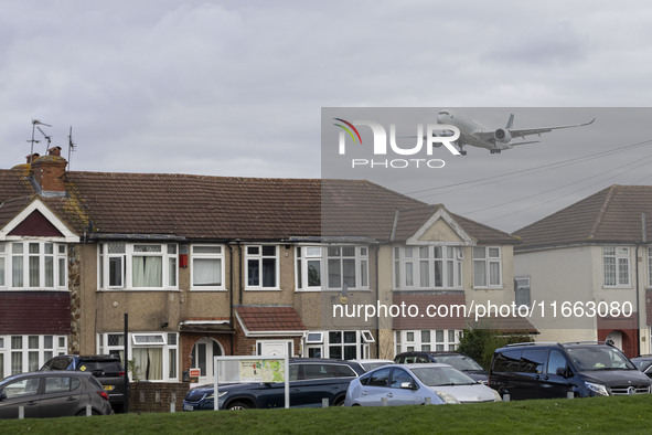 Cathay Pacific Airbus A350-900 passenger aircraft spotted flying over the houses in Myrtle Avenue before landing at London Heathrow Airport...