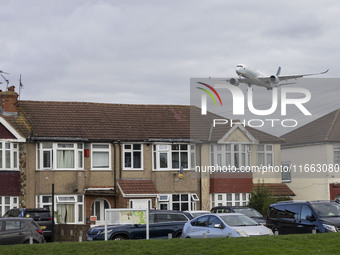 Cathay Pacific Airbus A350-900 passenger aircraft spotted flying over the houses in Myrtle Avenue before landing at London Heathrow Airport...