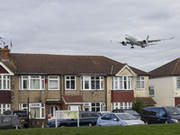 Cathay Pacific Airbus A350-900 passenger aircraft spotted flying over the houses in Myrtle Avenue before landing at London Heathrow Airport...