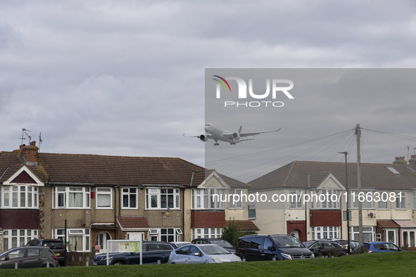 Cathay Pacific Airbus A350-900 passenger aircraft spotted flying over the houses in Myrtle Avenue before landing at London Heathrow Airport...