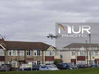 Cathay Pacific Airbus A350-900 passenger aircraft spotted flying over the houses in Myrtle Avenue before landing at London Heathrow Airport...