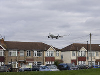 Cathay Pacific Airbus A350-900 passenger aircraft spotted flying over the houses in Myrtle Avenue before landing at London Heathrow Airport...