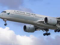 Cathay Pacific Airbus A350-900 passenger aircraft spotted flying over the houses in Myrtle Avenue before landing at London Heathrow Airport...