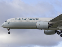 Cathay Pacific Airbus A350-900 passenger aircraft spotted flying over the houses in Myrtle Avenue before landing at London Heathrow Airport...