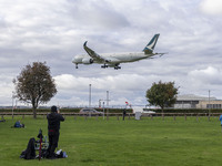 Cathay Pacific Airbus A350-900 passenger aircraft spotted flying over the houses in Myrtle Avenue before landing at London Heathrow Airport...