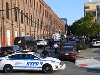 Authorities investigate the scene where a police officer dies by suicide in the Sunset Park section of Brooklyn, New York, United States, on...