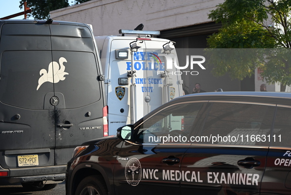 Authorities investigate the scene where a police officer dies by suicide in the Sunset Park section of Brooklyn, New York, United States, on...