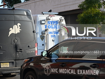 Authorities investigate the scene where a police officer dies by suicide in the Sunset Park section of Brooklyn, New York, United States, on...