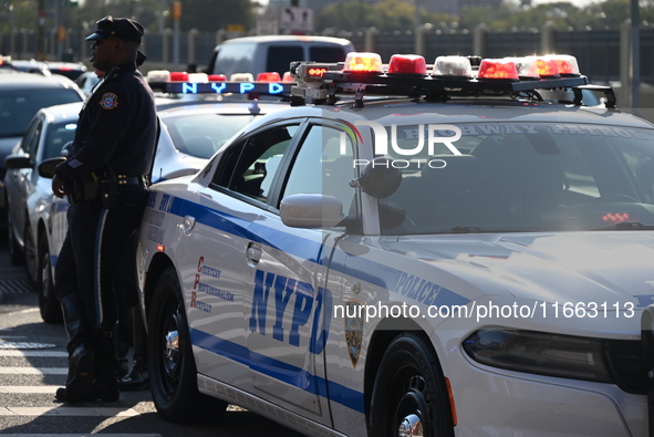 Authorities investigate the scene where a police officer dies by suicide in the Sunset Park section of Brooklyn, New York, United States, on...