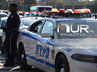 Authorities investigate the scene where a police officer dies by suicide in the Sunset Park section of Brooklyn, New York, United States, on...