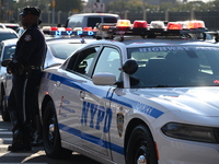 Authorities investigate the scene where a police officer dies by suicide in the Sunset Park section of Brooklyn, New York, United States, on...