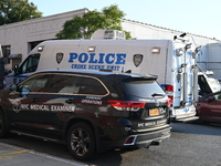 Authorities investigate the scene where a police officer dies by suicide in the Sunset Park section of Brooklyn, New York, United States, on...