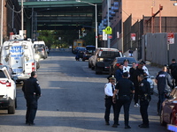 Authorities investigate the scene where a police officer dies by suicide in the Sunset Park section of Brooklyn, New York, United States, on...