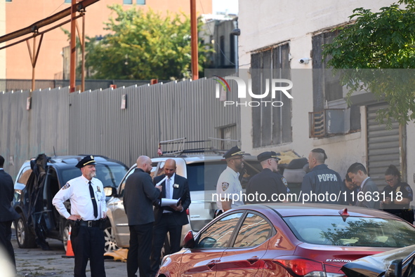 Authorities investigate the scene where a police officer dies by suicide in the Sunset Park section of Brooklyn, New York, United States, on...