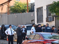 Authorities investigate the scene where a police officer dies by suicide in the Sunset Park section of Brooklyn, New York, United States, on...