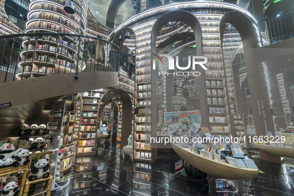 Visitors read books at Zhongshuge Bookstore in Chengdu, China, on October 13, 2024. 