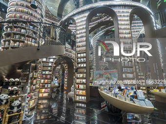 Visitors read books at Zhongshuge Bookstore in Chengdu, China, on October 13, 2024. (