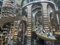 Visitors read books at Zhongshuge Bookstore in Chengdu, China, on October 13, 2024. (