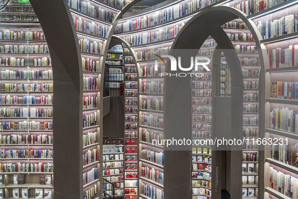 Visitors read books at Zhongshuge Bookstore in Chengdu, China, on October 13, 2024. 