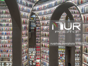 Visitors read books at Zhongshuge Bookstore in Chengdu, China, on October 13, 2024. (