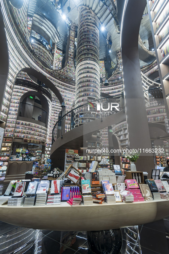 Visitors read books at Zhongshuge Bookstore in Chengdu, China, on October 13, 2024. 